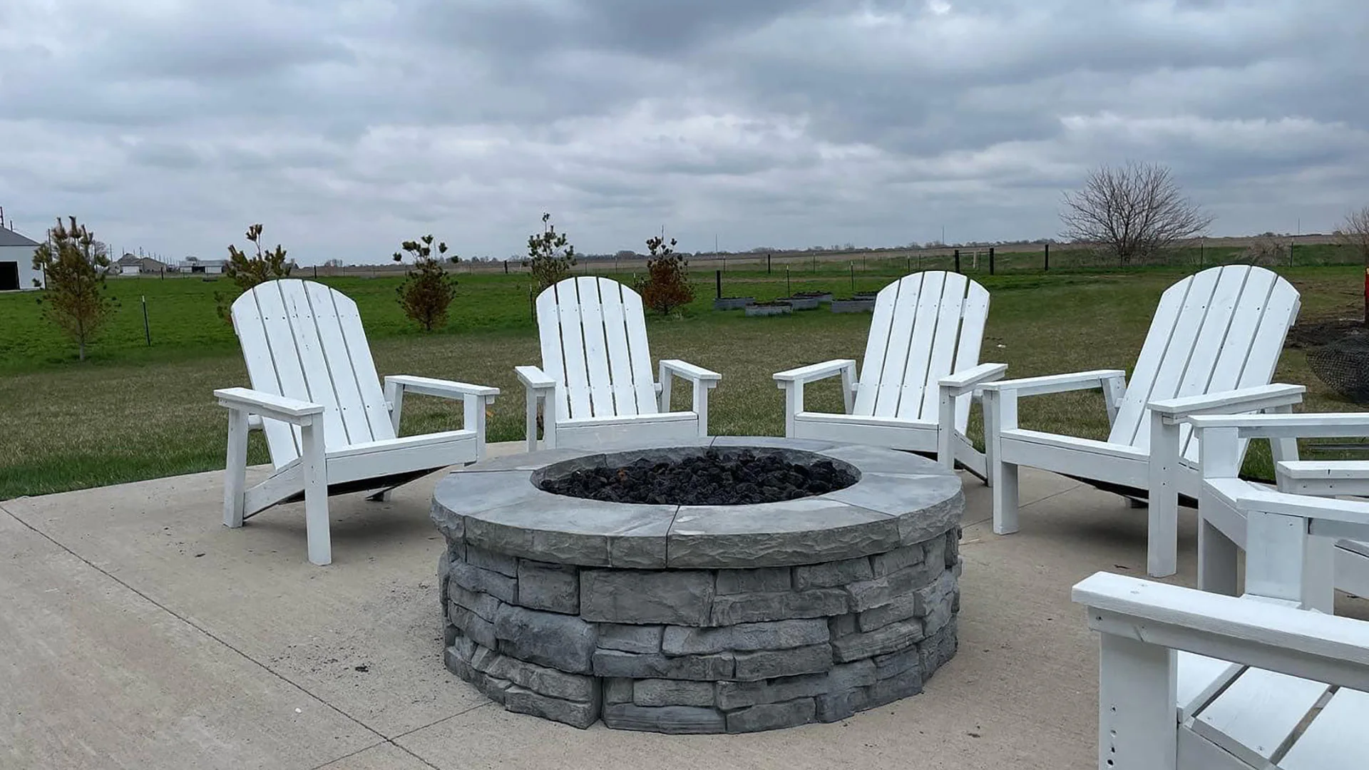 Chairs around a custom built fire pit in Altoona, IA.