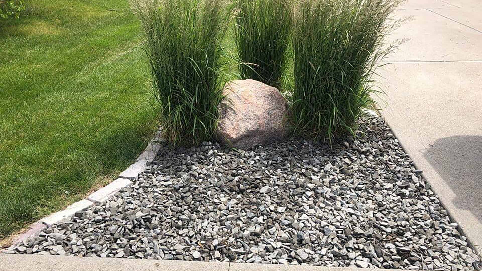 Rocks installed for landscape bed in Bondurant, IA.
