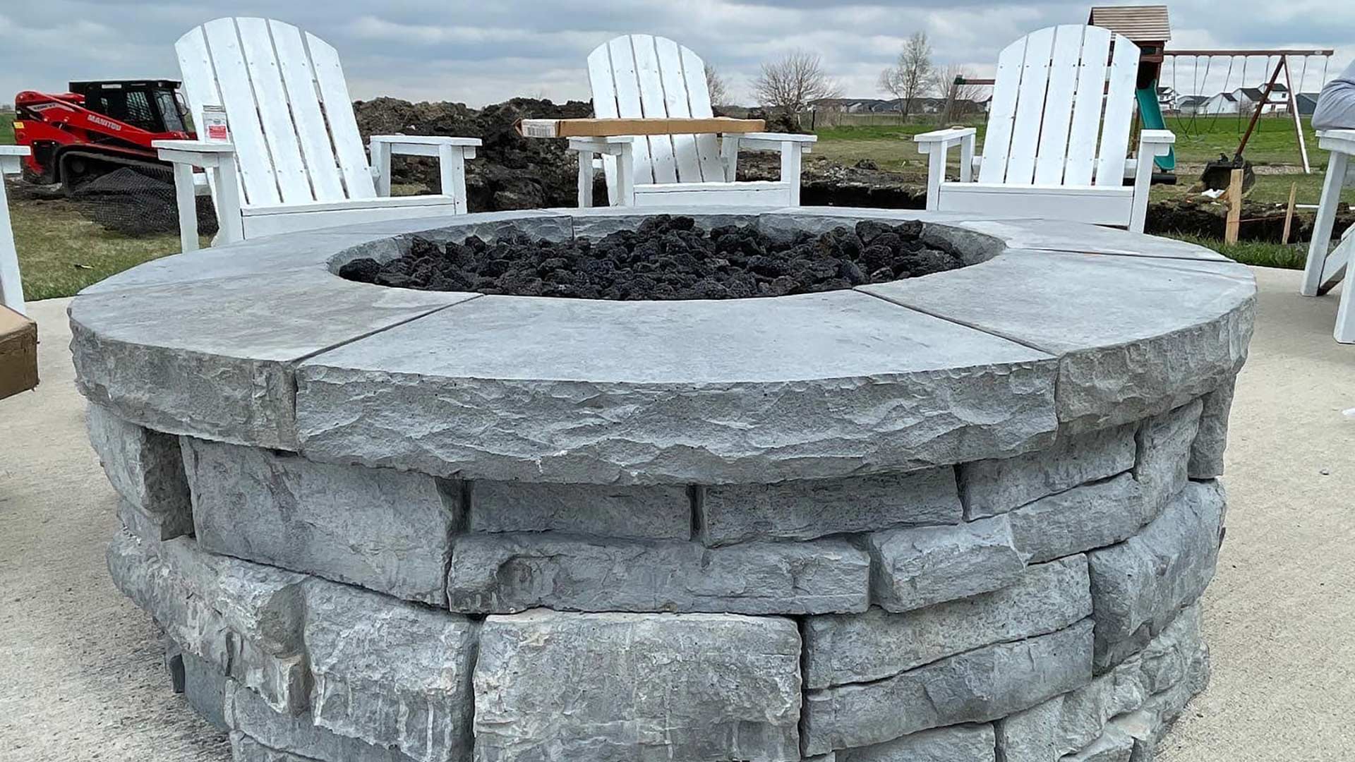 Fire pit installed over a patio in Bondurant, IA.