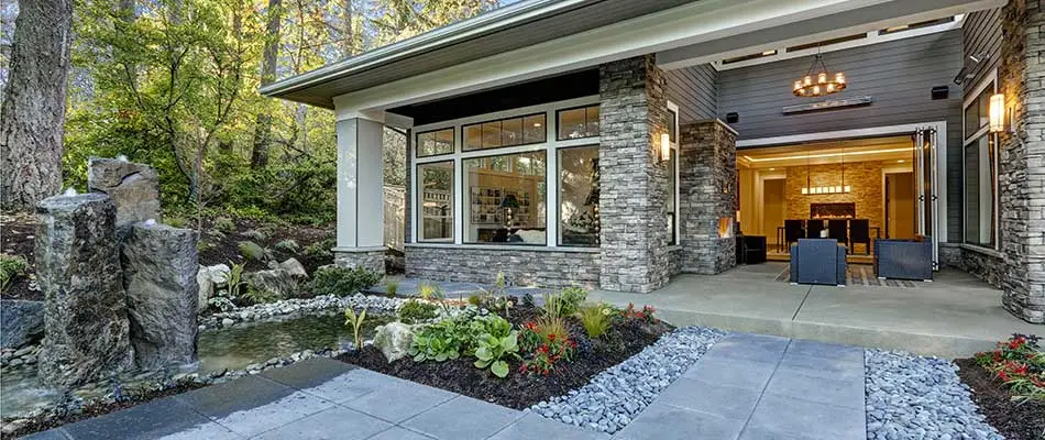 Custom patio area with water features and landscaping near Ankeny, IA.