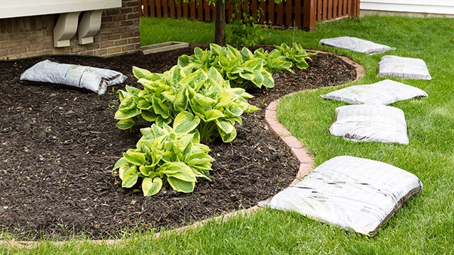 Mulch added to landscape bed in Bondurant, IA.