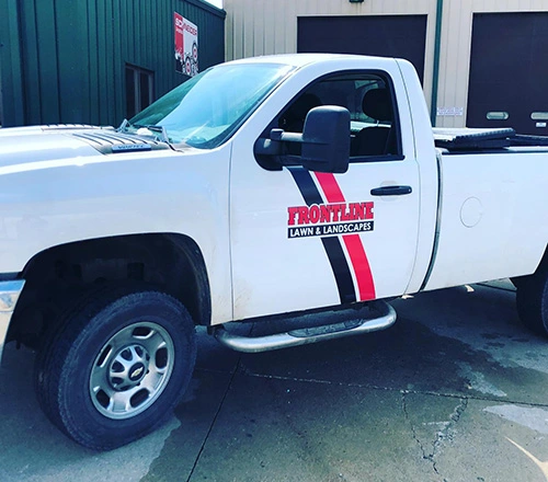 Frontline Lawn & Landscapes branded truck.